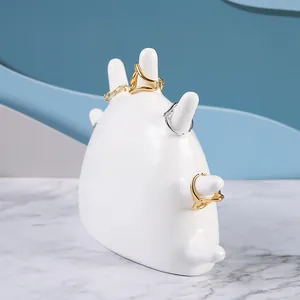 Nordic white resin seven-finger ring holder organizer tray for jewelry display on marble surface