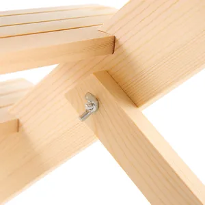 Close-up of metal wing nut and bolt on solid wood display stand showing easy assembly