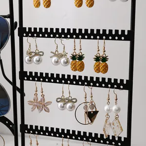 Présentoir à bijoux en métal noir à plusieurs niveaux avec boucles d'oreilles