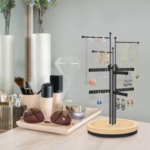 Black metal jewelry organizer with wooden base for earrings and necklaces