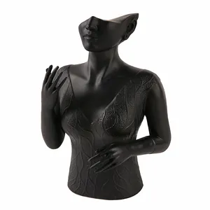 Matte black resin bust jewelry stand featuring elf ears and textured wave pattern relief