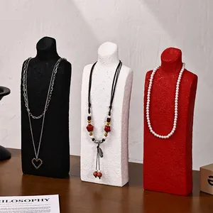 Three-piece bust necklace display stand set in black white and red textured finish