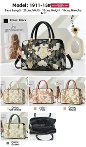Close-up of internal compartments and floral embroidery of the faux leather handbag