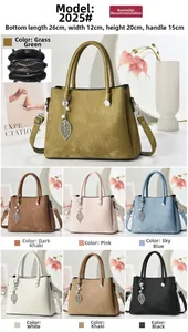 Detailed view of women's tote bag size 26x12x20cm with metallic leaf charm and corduroy texture