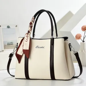 Elegant two-tone bucket handbag with lychee pattern and decorative silk scarf