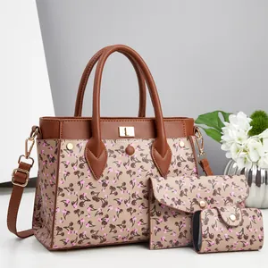 Detailed set of cherry pattern tote, clutch, and coin purse with gold hardware