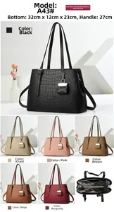 Detail view of large tote bag interior and diverse colors in crocodile pattern finish