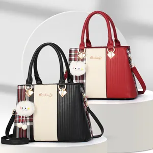Textured plaid tote bag with top handles and plush charm in black and red contrast