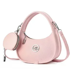 Sac à main demi-lune rose en cuir grainé avec mini porte-monnaie et logo d'oiseau argenté