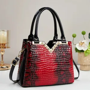 Red and black gradient crocodile pattern tote bag with gold V-hardware and rhinestones