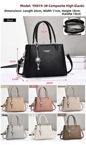 Detailed view of the elegant multi-compartment interior and lychee texture of the handbag