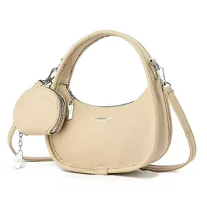 Sac hobo beige en forme de croissant avec pochette ronde en cuir grainé texturé