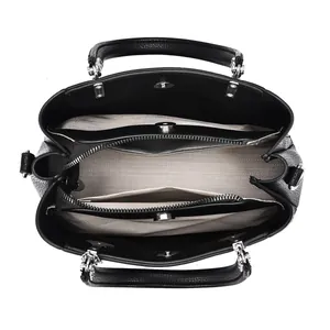 Top view of spacious interior with multi-compartment dividers in black leather tote bag