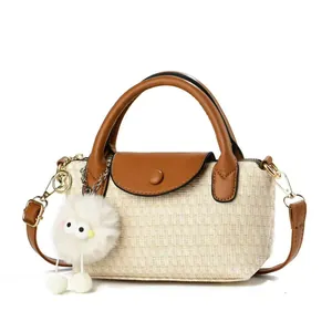 Chic beige woven handbag with brown leather flap and cute plush chick charm