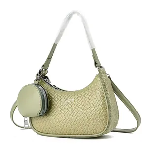 Sage green woven hobo bag with a matching coin purse and detachable shoulder strap