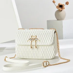 Elegant white pleated shoulder bag with golden swan clasp and pearl detail on a chain strap