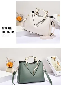 Detail of cat-ear metal handles and V-shaped accents on chic beige and green handbags