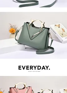 Chic cat-ear metal handle shell bags in various pastel colors on display