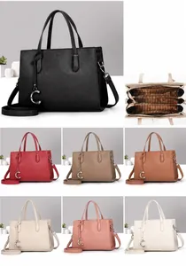 Detail view of large capacity PU tote bag with three internal compartments and 27cm width
