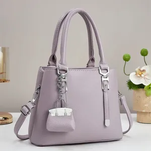 Elegante lavendelpaarse leren handtas met lychee-patroon en bijpassende mini-tasbedel