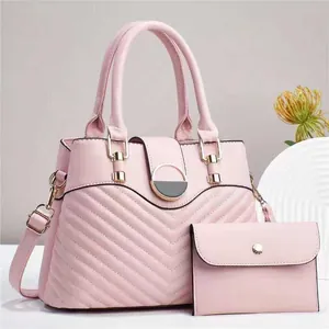 Pink V-quilted faux leather handbag with matching clutch and gold metal hardware detail