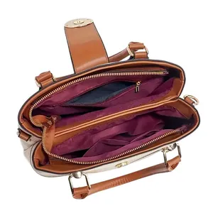 Interior view of large tote bag with multi-layer purple lining and golden zippers