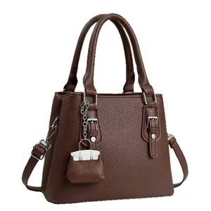 Brown lychee texture tote bag with top handles and adjustable shoulder strap for women