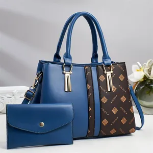 Minimalist bicolor tote bag with floral print and matching envelope purse for women