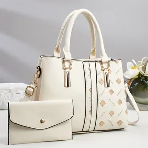 Chic cream patchwork tote bag and envelope clutch set with stylish letter print details