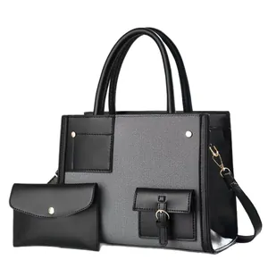 Bolso tote de denim gris y cuero negro con pochette a juego y detalles dorados