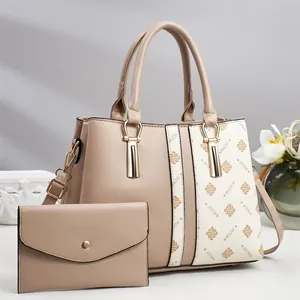 Close-up of contrast crossbody bag and wallet set with litchi grain texture