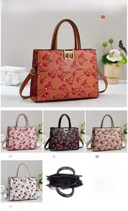 Detailed views of cherry print tote bag in five colors with interior and size info