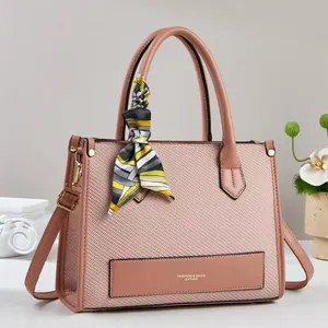 Pink patchwork canvas tote bag with woven texture and decorative silk scarf handles