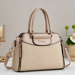Beige woven leather handbag with gold Danbaoly logo and matching shoulder strap