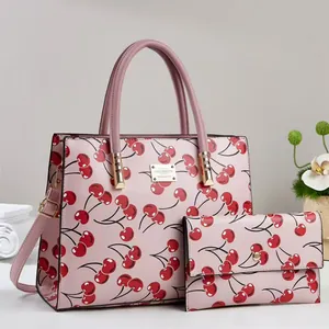 Pink cherry print handbag and wallet set with gold hardware and dual handles