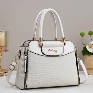 Elegant cream woven leather handbag with gold metal logo and adjustable strap