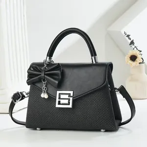 Elegant black contrast small square bag with bow pearl pendant and top handle