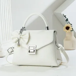 Elegant white woven textured flap handbag with silver G-buckle and pearl bow charm