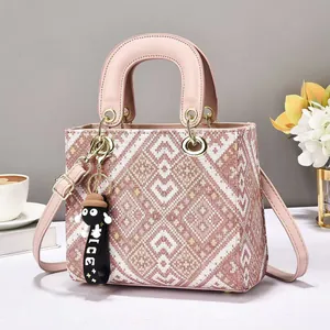 Pink jacquard tote bag with leather handles and detachable strap for elegant casual wear