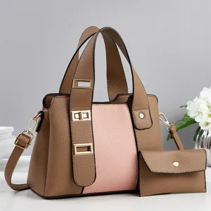 Chic pink and brown lychee textured handbag set with adjustable strap and matching wallet