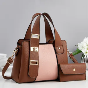 Pink and brown pebbled leather handbag with matching coin purse and gold buckle