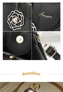 Close-up of black litchi pattern leather texture with gold logo and floral pearl charm