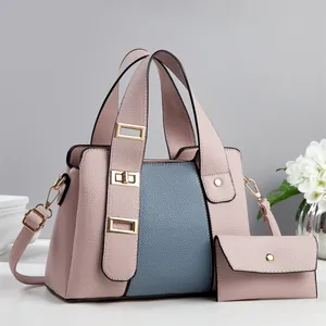 Chic pink and blue lychee leather handbag set with premium gold twist lock and floral accents