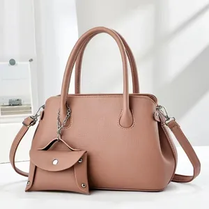 Pink lychee texture leather tote bag with matching coin purse pendant and top handles
