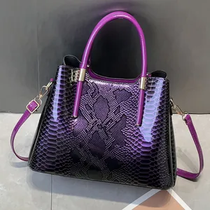 Glossy purple snake skin tote bag with gold hardware and gradient finish for women