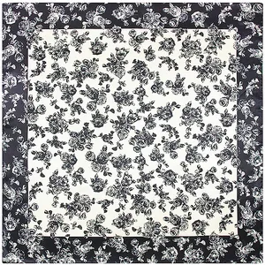 Detail shot of a large silk square scarf with vintage black rose prints and borders