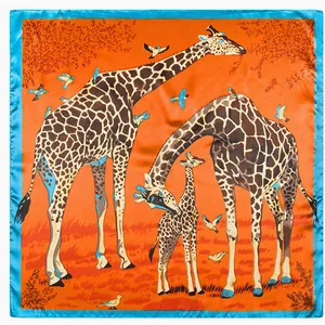 Square silk scarf featuring a vibrant orange giraffe pattern with blue border
