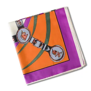 Detailed view of large silk scarf featuring equestrian belts and unicorn emblem pattern