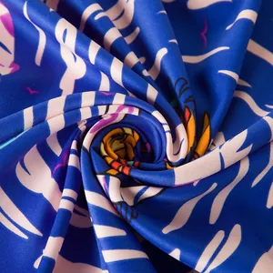 Macro shot of 130cm large silk scarf showing twill texture and vibrant blue patterns