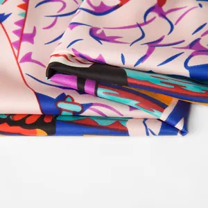 Macro shot of colorful twill silk scarf showing rich artistic print and smooth texture